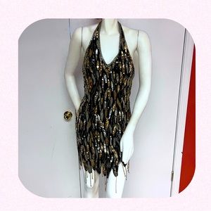 Stunning sequined mini with open back. Size 4